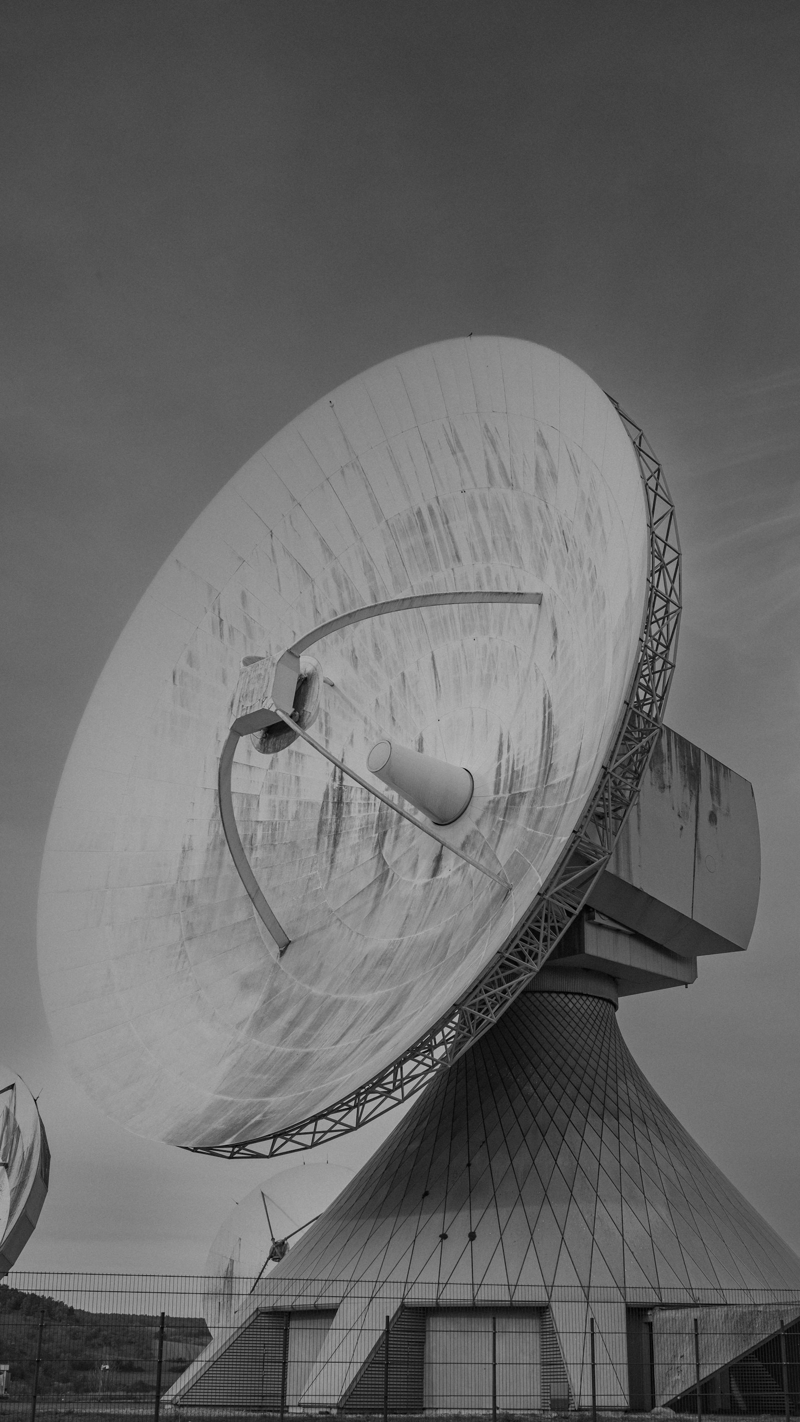 Large radar and satellite dish antenna at a defense facility