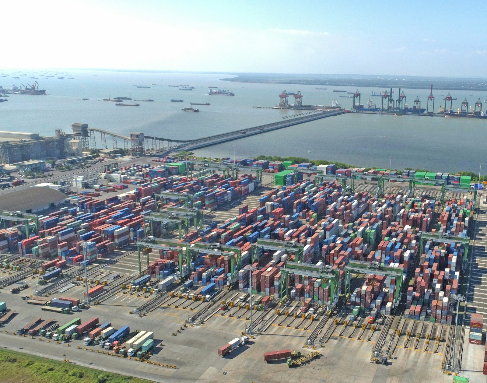 Aerial view of a shipping port stacked with cargo containers